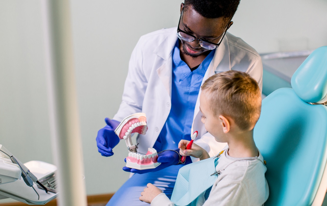 Dentist and pediatric patient