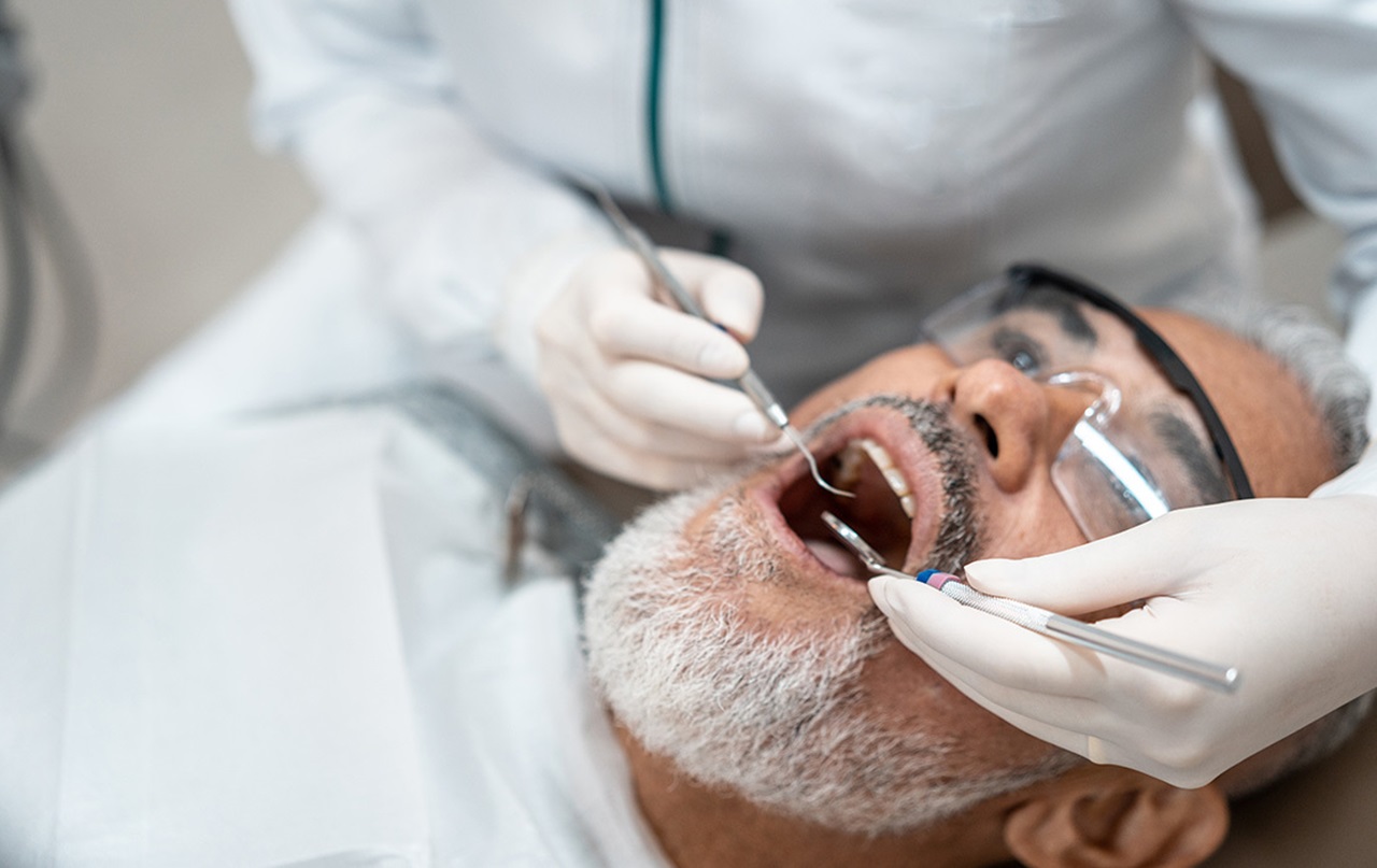 Photo of a dentist examining a patient