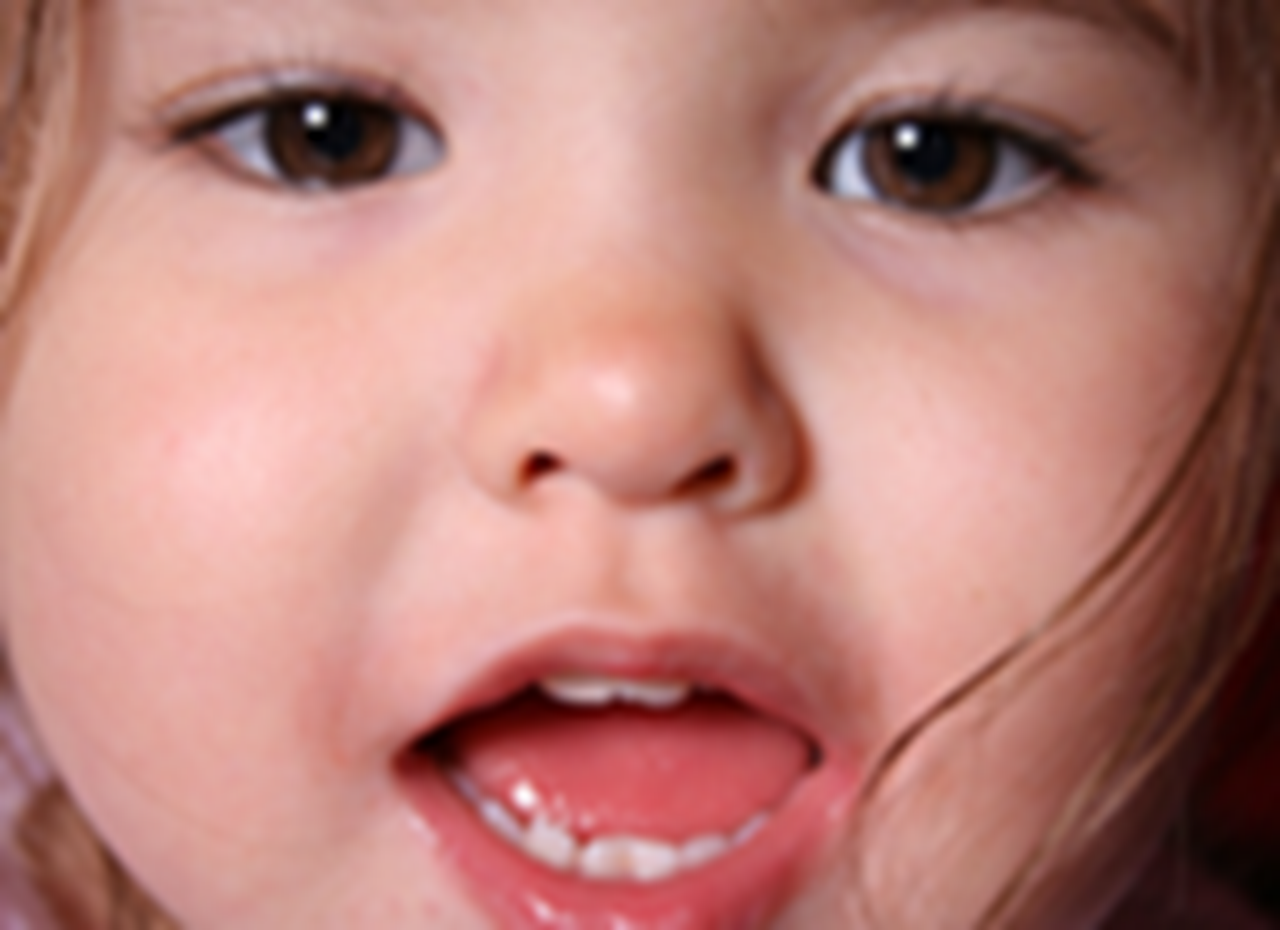A photograph of a one-year-old girl.