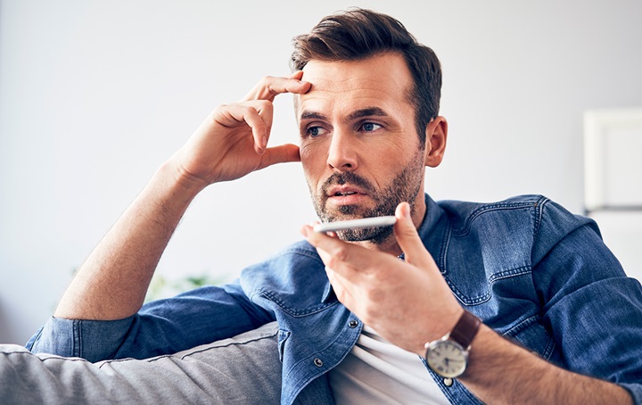 Anxious man on phone