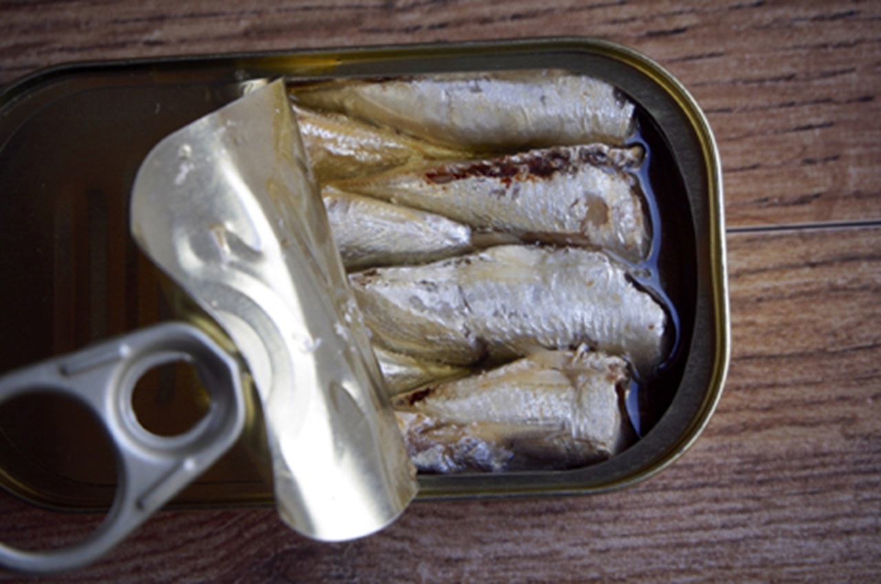 Open canned sardines.