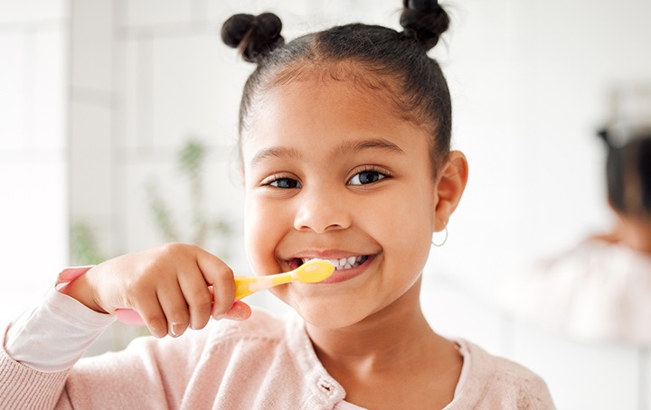 Child brushing teeth