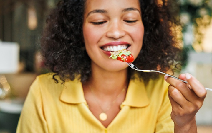 Woman contemplating her food choices