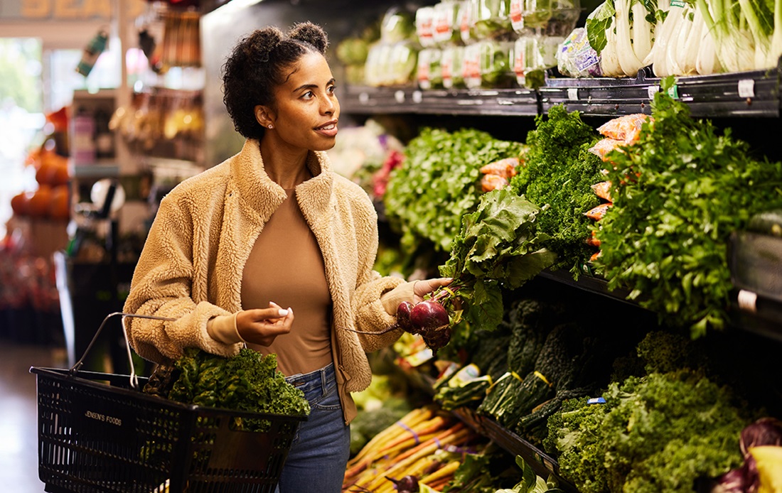 Woman shopping at vegetable store