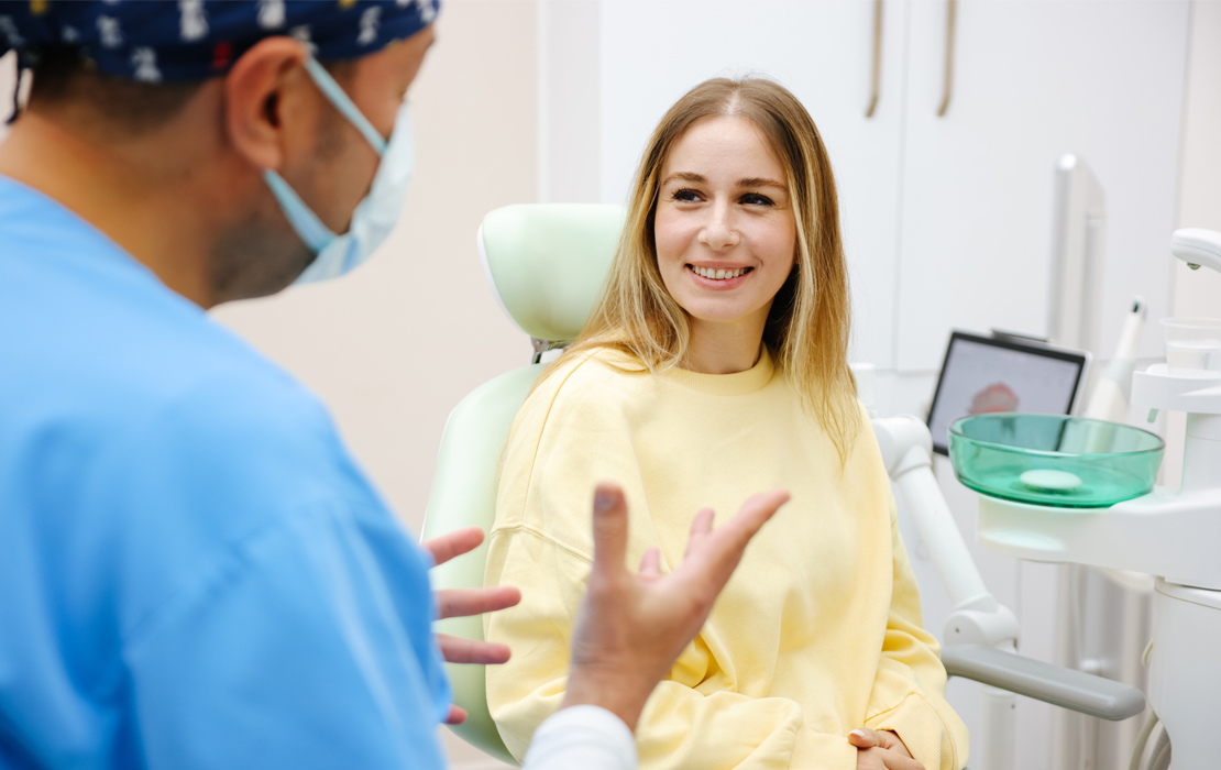 Dentist speaking to patient