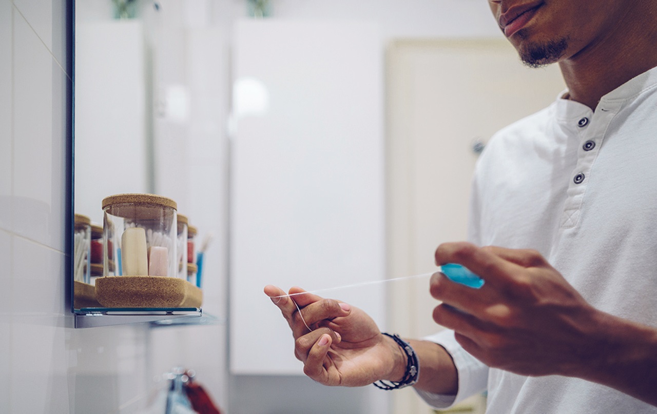 MouthHealthy Man flossing