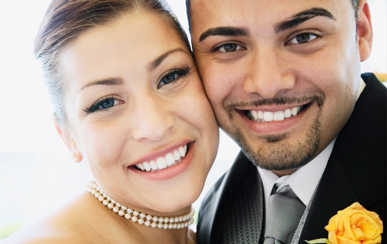A married couple, smiling.