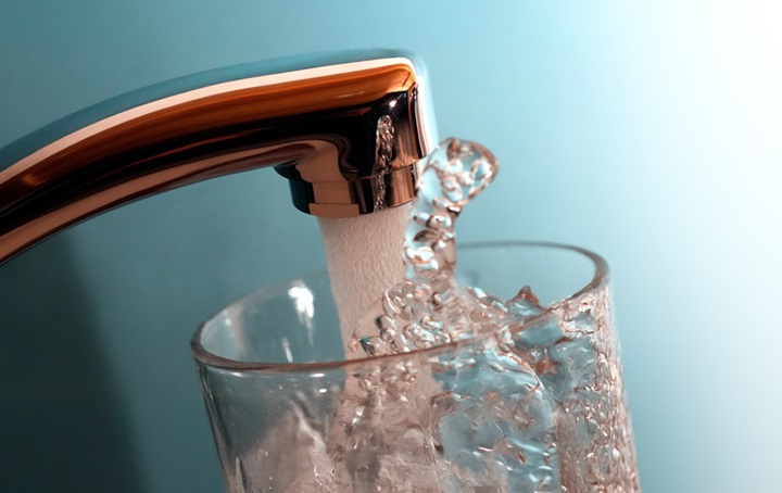 Picture of water filling a glass