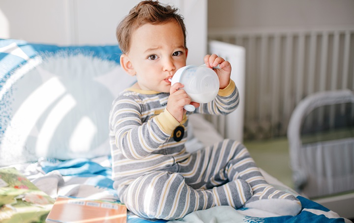 Toddler with sippy cup