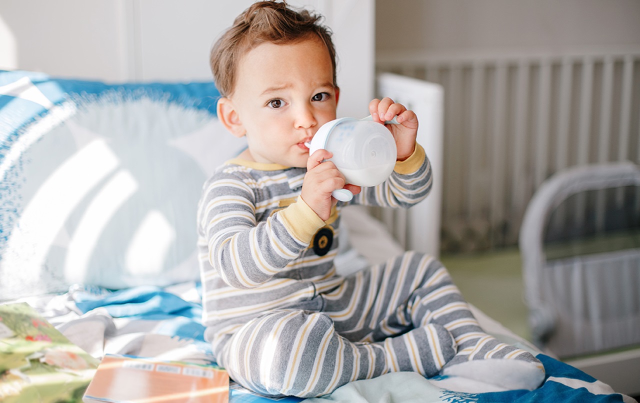 Toddler with sippy cup
