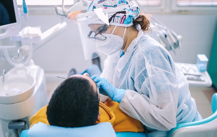 Image of dentist and a child patient