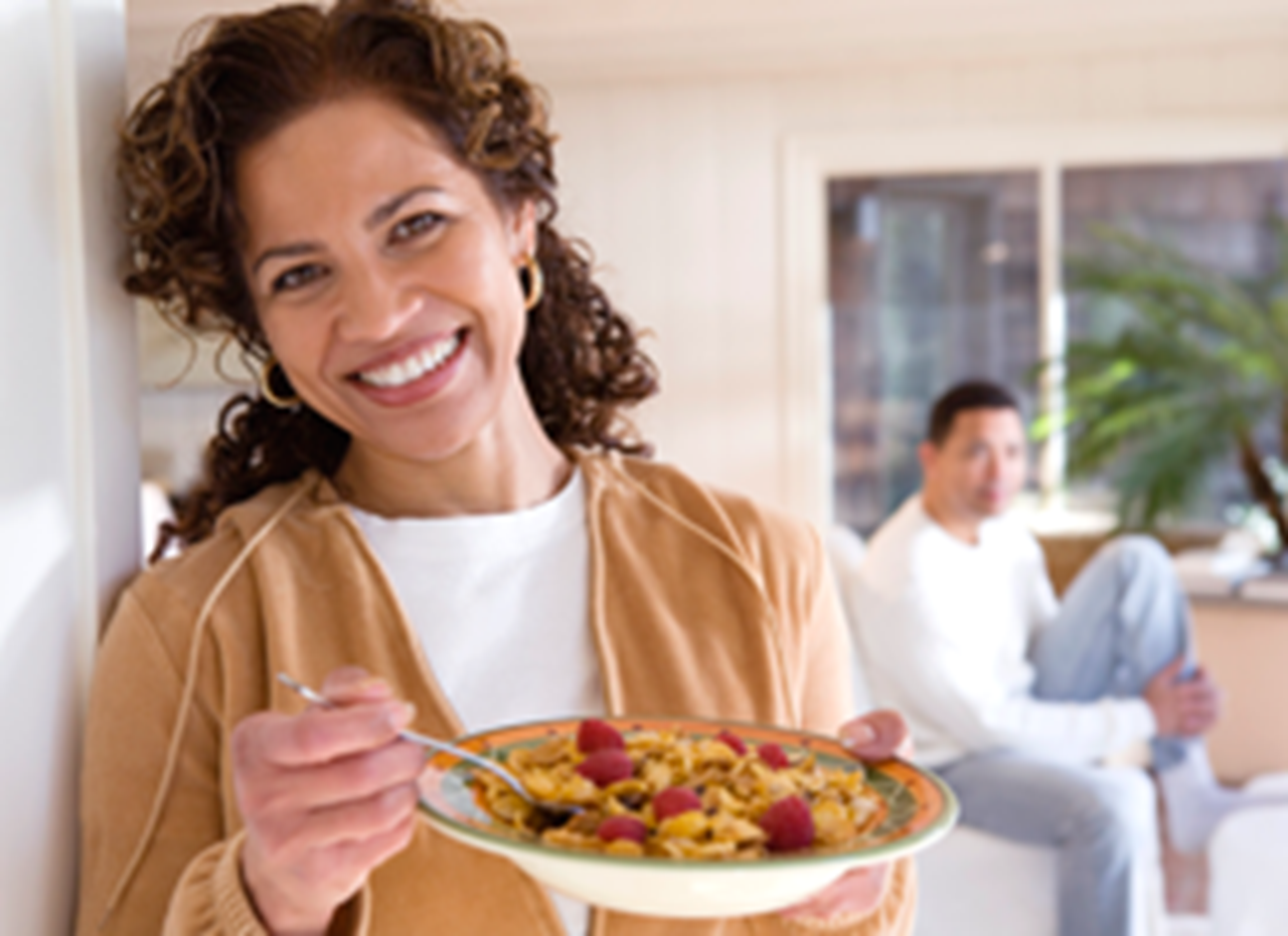 Image of a woman eating cereal