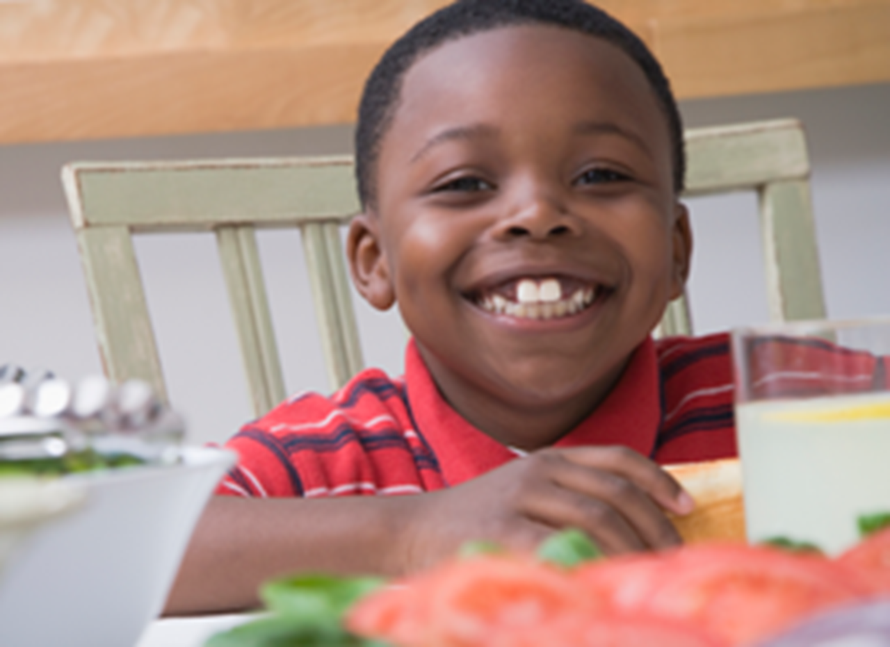 Smiling boy at the kitchen table