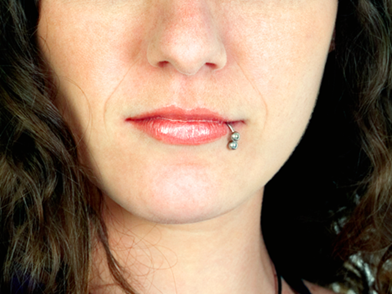 Photo of a woman with lip piercing