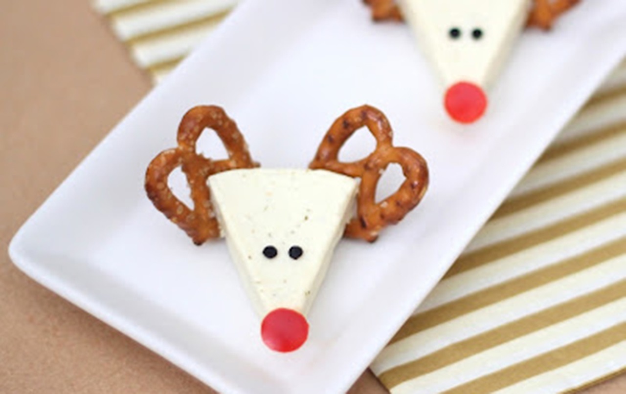 MouthHealthy holiday nutrition reindeer made of cheese wedge and pretzels