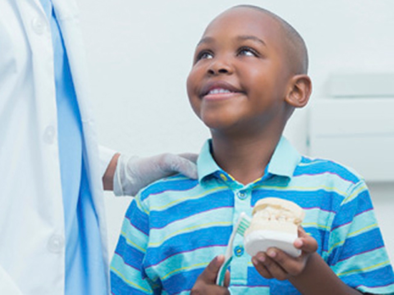 Boy smiling at his dentist