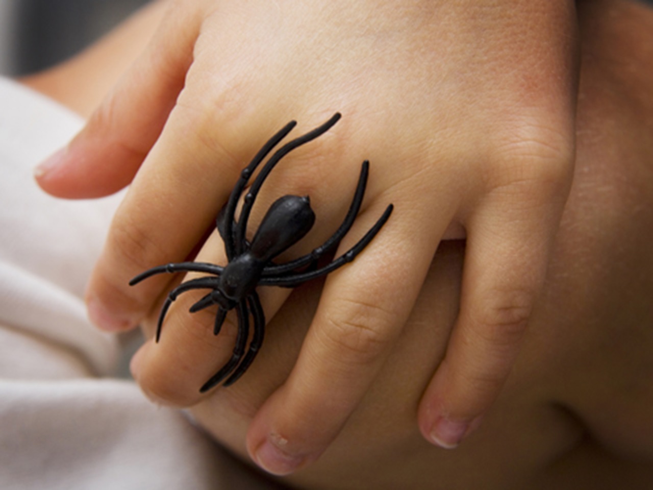 Child wearing spider ring